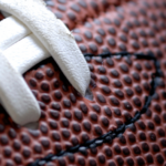 Close-up of a football with white laces, symbolizing college football and the Toledo Rockets