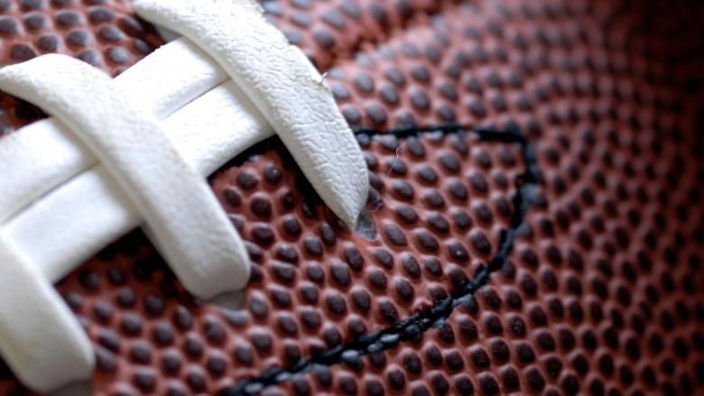Close-up of a football with white laces, symbolizing college football and the Toledo Rockets