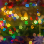 Rainbow holiday lights symbolizing pride and inclusivity at a festive LGBTQ community event